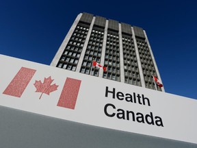 A sign is displayed in front of Health Canada headquarters in Ottawa on Friday, January 3, 2014.