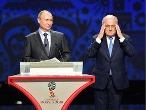 SAINT PETERSBURG, RUSSIA - JULY 25:  Vladimir Putin, President of Russia and FIFA President Joseph S. Blatter speak during the Preliminary Draw of the 2018 FIFA World Cup in Russia at The Konstantin Palace on July 25, 2015 in Saint Petersburg, Russia.