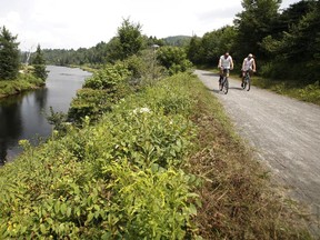 Bikers enjoy the view along the 200-km bike path from St-Jérôme to Mont Laurier built over the old P'tit Train du Nord train line.