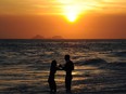 A couple enjoy the last day of spring on Ipanema beach, before the start of the summer in the southern hemisphere, in Rio de Janeiro, Brazil on December 20, 2012.