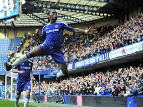 Chelsea's Ivorian striker Didier Drogba celebrates scoring the opening goal of the English Premier League football match between Chelsea and Stoke City at Stamford Bridge in London, on March 10, 2012.