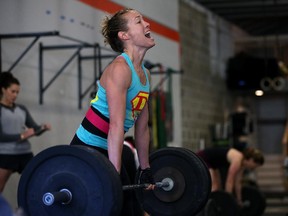 Lita Collins does a deadlift during a CrossFit workout at Ross Valley CrossFit on March 14, 2014 in San Anselmo, Calif. CrossFit, a high- intensity workout regimen that is a constantly varied mix of aerobic exercise, gymnastics and Olympic weightlifting, is one of the fastest- growing fitness programs in the world.