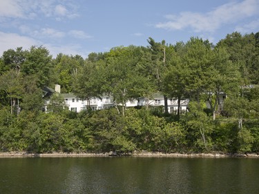 Surrounded by trees and greenery, Manoir Hovey is afforded some measure of privacy when viewed from Lake Massawippi.
