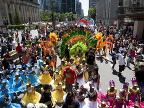 Dancers take part in the Carifiesta parade, celebrating all things Caribbean, in Montreal on Saturday, July 6, 2008.