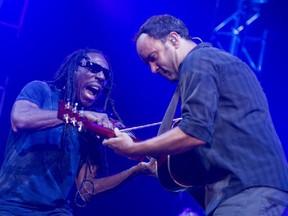 Dave Matthews, right, performs alongside violinist Boyd Tinsley in concert at the Bell Centre in Montreal, Wednesday, July 22, 2015.