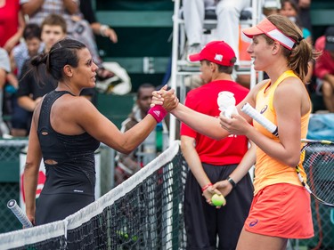 Winner Johanna Konta of Great Britain, right, shakes hands with opponent Stephanie Foretz of France, left, after their women's final in the National Bank Granby Challenger tennis tournament in Granby, south of Montreal on Sunday, July 26, 2015.
