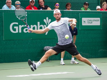 Philip Bester of Canada hits a return against Vincent Millot of France during the men's final of the National Bank Granby Challenger tennis tournament in Granby, south of Montreal on Sunday, July 26, 2015.