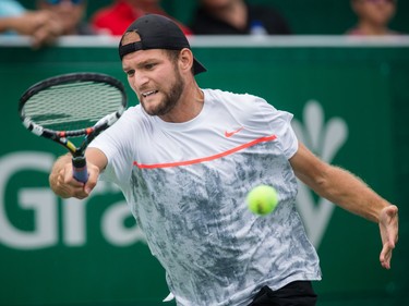 Philip Bester of Canada hits a return against Vincent Millot of France during the men's final of the National Bank Granby Challenger tennis tournament in Granby, south of Montreal on Sunday, July 26, 2015.