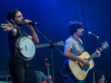 Scott Avett, left, and brother Seth Avett, right, of the Avett Brothers perform on day one of the 2015 edition of the Osheaga Music Festival at Jean-Drapeau park in Montreal on Friday, July 31, 2015.