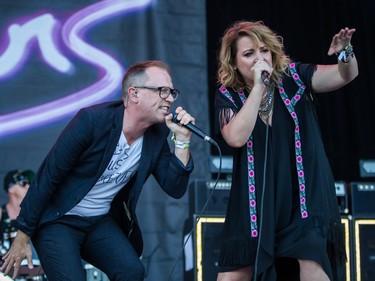 Torquil Campbell, left, and Amy Millan, right, of the band Stars perform on day one of the 2015 edition of the Osheaga Music Festival at Jean-Drapeau park in Montreal on Friday, July 31, 2015. (Dario Ayala / Montreal Gazette)