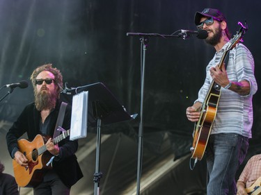 Sam Beam, left, of Iron & Wine and Ben Bridwell, right, perform on Day 1 of the 2015 edition of the Osheaga Music and Arts Festival at Parc Jean-Drapeau in Montreal on Friday, July 31, 2015.