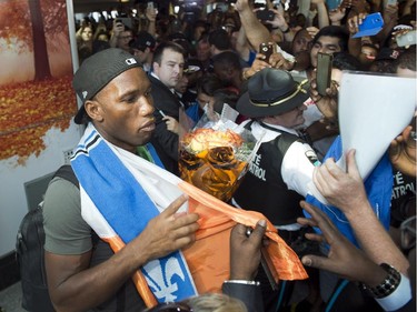 Montreal Impact's newest player Didier Drogba is greeted by fans as he arrives at Trudeau airport Wednesday, July 29, 2015 in Montreal .THE CANADIAN PRESS/Ryan Remiorz