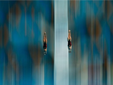KAZAN, RUSSIA - JULY 27:  Meaghan Benfeito and Roselin Filion of Canada compete in the Women's 10m Platform Synchronised Final on day three of the 16th FINA World Championships at the Aquatics Palace on July 27, 2015 in Kazan, Russia.