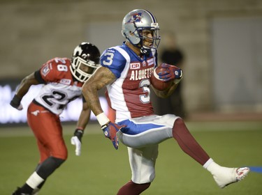Montreal Alouettes wide receiver Cody Hoffman (3) runs in a touchdown as Calgary Stampeders defensive back Brandon Smith (28) looks on during second half CFL football action in Montreal, Friday July 3, 2015. THE CANADIAN PRESS/Ryan Remiorz