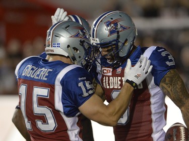 Montreal Alouettes wide receiver Cody Hoffman (3) celebrates his touchdown against the Calgary Stampeders with teammate Samuel Giguere (15) during second half CFL football action in Montreal, Friday July 3, 2015. THE CANADIAN PRESS/Ryan Remiorz