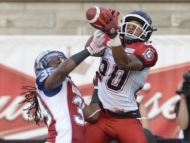 Montreal Alouettes defensive back Jerald Brown (39) breaks up the pass as Calgary Stampeders wide receiver Eric Rogers fails to make the catch during first half CFL football action in Montreal, Friday July 3, 2015. THE CANADIAN PRESS/Ryan Remiorz