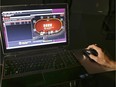 A sample poker game is played on the Ultimate Gaming website.
