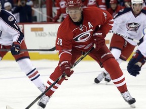 In this photo taken Wednesday, Sept. 18, 2013, Carolina Hurricanes' Alexander Semin (28), of Russia, skates against the Columbus Blue Jackets during the second period of a preseason NHL hockey game in Raleigh, N.C. The NHL's realignment meant the end of the Southeast Division and placed the Hurricanes into the new Metropolitan Division. (AP Photo/Gerry Broome)