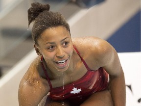 Jennifer Abel of Canada smiles after her final dive to win the gold medal in Women's 3m Springboard Diving at the 2015 Pan Am games in Toronto on Sunday, July 12, 2015.