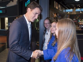 Federal Liberal Leader Justin Trudeau greets staff during a visit to the Cosmodome Tuesday, July 21, 2015 in Laval, Que.