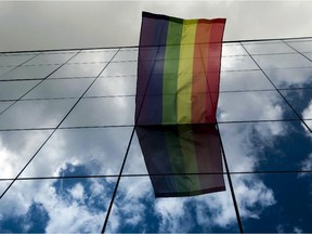 A rainbow flag is displayed on the building of the European Council Office.