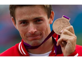 Canada's Mark Oldershaw celebrates bronze in the men's 1000-metre canoe single (C1) final at Eton Dorney during the 2012 Summer Olympics in Dorney, England on Friday, August 8, 2012.THE CANADIAN PRESS/Sean Kilpatrick