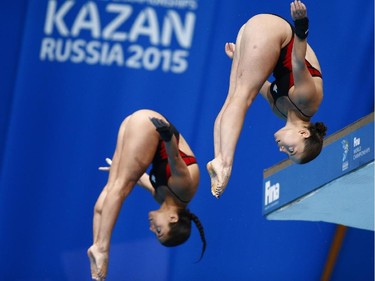 Canada's silver medalists Meaghan Benfeito and Roseline Filion compete during the women's synchronised 10m platform diving final at the Swimming World Championships in Kazan, Russia, Monday, July 27, 2015.