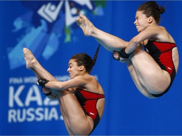 Canada's silver medalists Meaghan Benfeito and Roseline Filion compete during the women's synchronised 10m platform diving final at the Swimming World Championships in Kazan, Russia, Monday, July 27, 2015.
