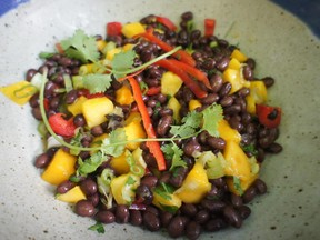 Meat, gluten, dairy: trying to cater to common food restrictions is easier if you avoid them. This salad features black beans and mango.