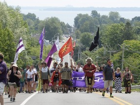 Mohawks from Kanesatake march to mark the 25th anniversary of the Oka crisis.