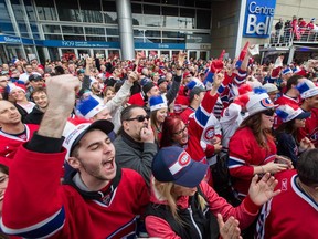 MONTREAL, QUE.: APRIL 20, 2014 -- Montreal Canadiens fans cheer as they gather outside the Bell Centre before the Canadiens third NHL Eastern Conference quarterfinal playoff game against the Tampa Bay Lightning in Montreal on Sunday, April 20, 2014. (Dario Ayala / THE GAZETTE) ORG XMIT: 49725