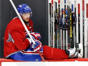 Canadiens Andrei Markov sits on the edge of the boards during practice at their training facility in Brossard, south of Montreal Friday April 25, 2014.   (John Mahoney /THE GAZETTE