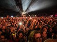 Music fans watch a performance at the 2013 Osheaga Music Festival at Jean-Drapeau Park.