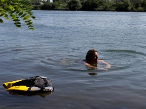 Montreal city councillor for the Verdun borough  Marie-Andrée Mauger swims in the St. Lawrence River near Verdun.
