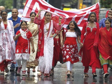 Members of the Indian community march down Ste-Catherine St. during Canada Day parade in Montreal Wednesday July 1, 2015.
