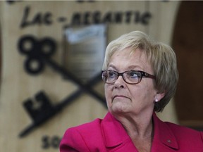 Mayor Colette Roy Laroche listens to Quebec Red Cross director general Michel Leveille at press conference at the city hall in Lac Megantic Thursday July 2, 2015.