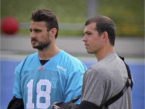 MONTREAL, QUE.: July 08, 2015 -- Injured quarterbacks Jonathan Crompton, left, and Dan LeFevour stand on the sideline during Montreal Alouettes practice at Stade Hebert in Montreal Wednesday July 08, 2015.  They both suffered shoulder injuries during the team's opening game of the season.  (John Mahoney / MONTREAL GAZETTE)