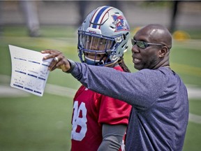 Alouettes defensive-back Dominique Ellis listens to special teams coordinator Kavis Reed during a drill at practice at Stade Hébert in on Wednesday July 08, 2015.  Reed is the a former head coach of the Edmonton Eskimos.