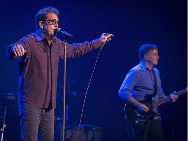 Huey Lewis and guitarist Chris Hayes perform during their concert at Salle Wilfrid-Pelletier of Place des Arts during the Montreal International Jazz Festival in Montreal, on Wednesday, July 1, 2015.