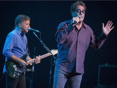 Huey Lewis and guitarist Chris Hayes perform during their concert at Salle Wilfrid-Pelletier of Place des Arts during the Montreal International Jazz Festival in Montreal, on Wednesday, July 1, 2015.