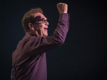Huey Lewis pumps his fist during the opening number as he performs in concert at Salle Wilfrid-Pelletier of Place des Arts during the Montreal International Jazz Festival in Montreal, on Wednesday, July 1, 2015.