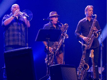 The Brass section of Huey Lewis and the news perform during their concert at Salle Wilfrid-Pelletier of Place des Arts during the Montreal International Jazz Festival in Montreal, on Wednesday, July 1, 2015.