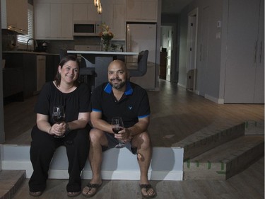 Erin Lefler and  Octavio Mateus sit in their still unfinished living room on Notre Dame St., in Montreal. This couple, in their 30s, are undergoing renovations to their 1,000 sq. ft condo.