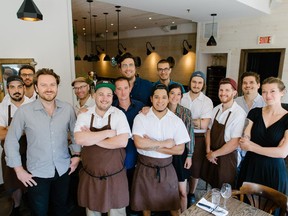 The staff of Les Fillettes restaurant including partners  Carl Champagne, front left, Jean-Sebastien Thomas, front second from left, and Frédéric Ouellet, rear centre.