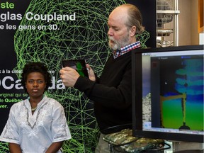 Canadian novelist and artist Douglas Coupland is creating an art piece of scanned people for Simons. Coupland tested his scanning setup on Daphnée Prosper at Simons in Montreal, on Friday, July 17, 2015, getting all the bugs out to be ready to scan members of the public on Saturday.
