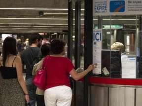 STM clients line up at a ticket booth.