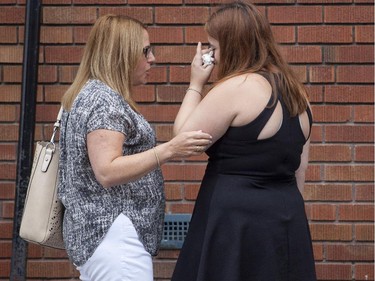 Friends and family of the murdered Samantha Higgins console each other outside the Feron's Funeral Home in Montreal, Saturday July 18, 2015.  (Vincenzo D'Alto / Montreal Gazette)