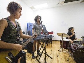 Ljuba Miltsova on guitar, Leela Merritte on the keyboards and Emma Bronson on the drums during a rehearsal at on Tuesday, July 21, 2015.