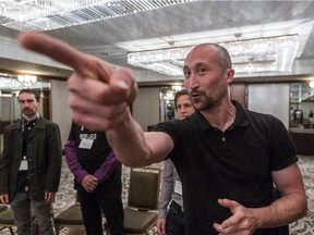 Marc Rowland, Montreal Improv Theatre director, leads a group of scientists at a biofuels conference through a series of improv exercises as a way of improvin, in Montreal on Wednesday, July 22, 2015.