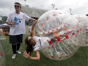 The Montreal Gazette's Brendan Kelly with TV and radio personality Natasha Gargiulo, who is getting ready to play Sumo soccer at a fundraising tournament on Sunday.